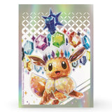 Pokemon Prismatic Evolutions ETB – holografische Kartenhuelle mit Eevee und prismatischen Edelsteinen, eine von 65